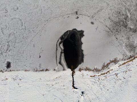 Aerial view of Ter lake frozen in wintertime near Le S&eacute;chey, Switzerland.