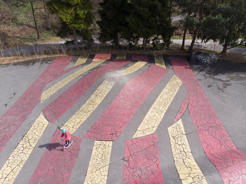 Aerial view of a kid playing in a playground, Lausanne, Switzerland.