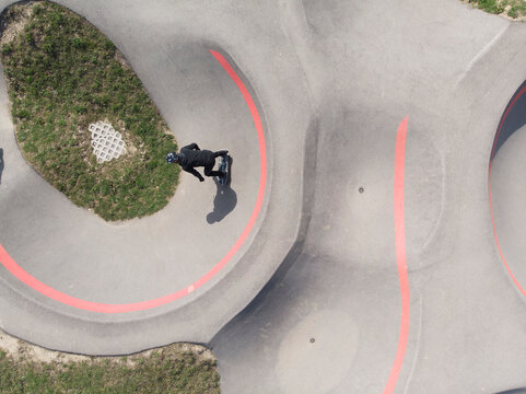 Aerial view of a person with a skateboard in a skate park, Pampigny, Switzerland.