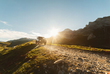 4x4 off-road car driving along a mountain track on a sunny day. car adventure trip © Alberto