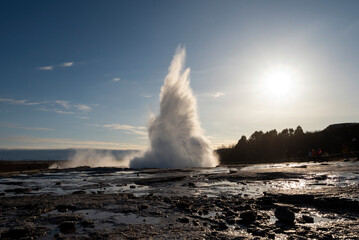 Eruption of the Strokkur geyser at dusk, less know but more active than the famous Great Geysir,...