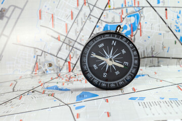 Compass on the map background of blur.