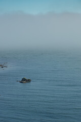 The Peninsula of Howth Head on a foggy day, the cliffs warped by fog, Dublin, Seashore of  cliffs, bays and rocks landscape, dangerouse cliffs, spectacular views in Ireland , Ireland