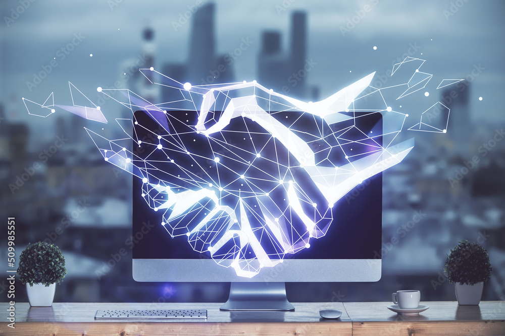 Poster desktop computer background in office and handshake hologram drawing. double exposure. pertnership c