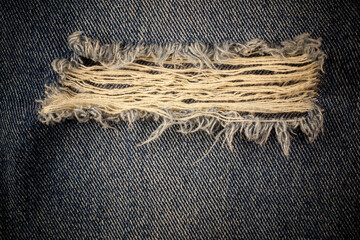 Vintage torn denim background.