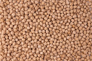 dry chickpeas as background texture, top view