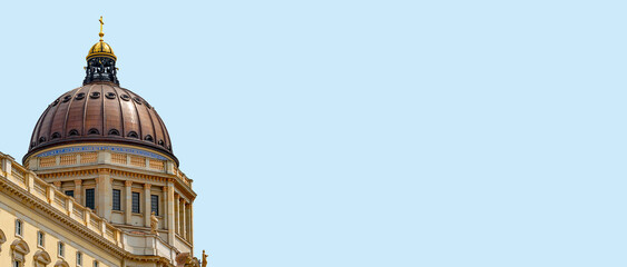 Banner with famous Berlin Royal Palace dome in historical and business downtown of Berlin, Germany, at blue sky solid background with copy space. © neurobite