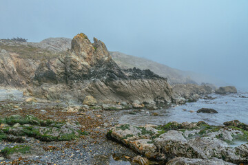 The Peninsula of Howth Head on a foggy day, the cliffs warped by fog, Dublin, Seashore of  cliffs, bays and rocks landscape, dangerouse cliffs, spectacular views in Ireland , Ireland