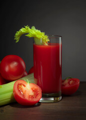 Tomato juice with celery sticks.