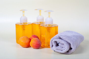 Obraz na płótnie Canvas peach ,liquid soap, towel