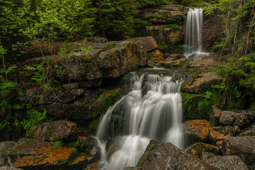 Naklejka na ściany i meble Waterfall of Jedlova creek in Jizerske mountains in spring morning