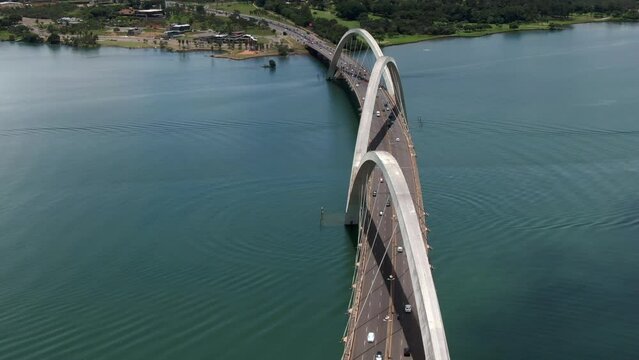 Aerial view of traffic on JK Bridge (Portuguese: Ponte JK ), a steel and concrete arch bridge across Lake Paranoa in Brasilia, Federal District, capital of Brazil.	