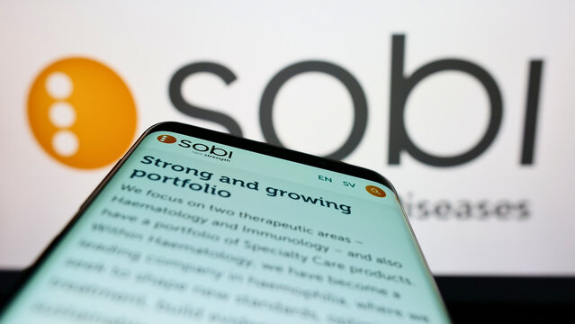 Stuttgart, Germany - 06-06-2022: Mobile phone with webpage of company Swedish Orphan Biovitrum AB (Sobi) on screen in front of business logo. Focus on top-left of phone display.