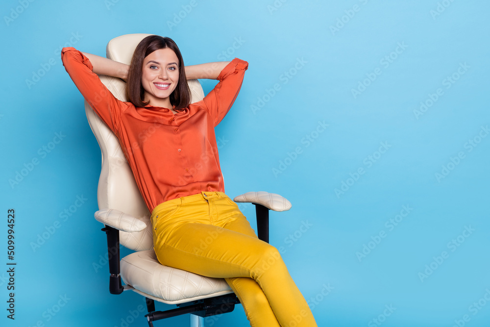 Sticker Portrait of attractive confident cheery girl agent broker director sitting in armchair resting isolated over bright blue color background