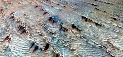 abstract landscape photo of the deserts of Africa from the air emulating the shapes and colors of...