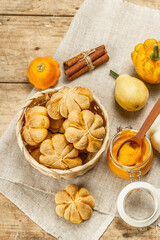 Pumpkin buns or biscuits, traditional fall baked goods. Seasonal ingredients for cooking food