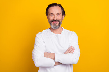 Photo of boss mature brunet man crossed arms wear white shirt isolated on yellow color background