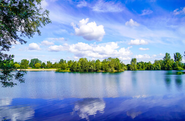 Swimming lake Schlicht near Neuhofen and Waldsee in Rhineland-Palatinate. View of the lake and the...