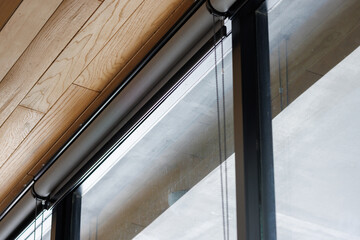 grey blind curtain or black blinds Roller sun protection in office.