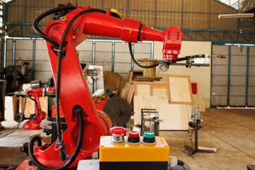 emergency stop button with blur background in industry factory. start stop button control welding robot blur background.