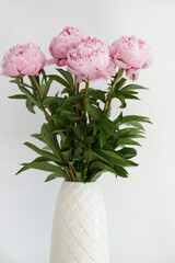 Beautiful wedding fresh pink peony bouquet in natural light