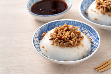 Taiwanese savory rice pudding Wa gui with chopped dried radish and soy sauce