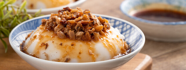 Taiwanese savory rice pudding Wa gui with chopped dried radish and soy sauce