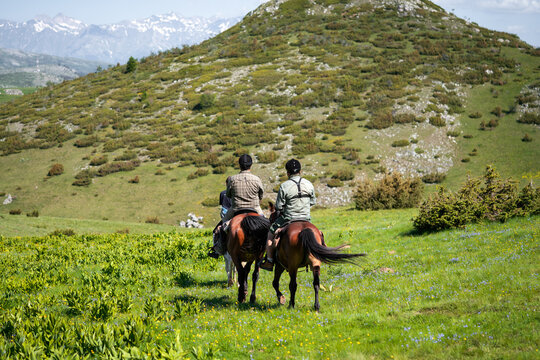 Group of horseback riders ride in Galicnik, North Macedonia