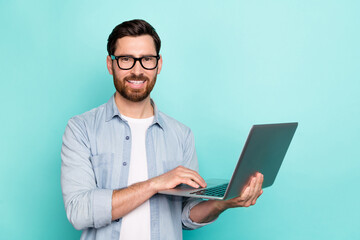 Photo of professional marketer guy use netbook typing colleagues start-up information isolated cyan...