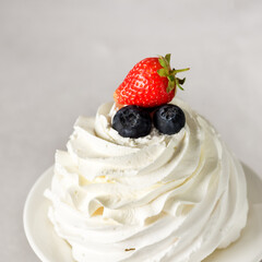 Delicious Mini Pavlova Cake with Fresh Strawberry and Blueberry Tasty Dessert Gray Background Above Square