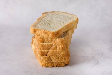 Stack of Sliced White Bread on Gray Background Horizontal