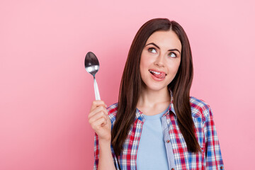 Photo of cute tricky thoughtful girl look empty space dreaming about food isolated on pink color background