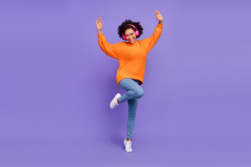 Fototapeta na wymiar Full length body size view of attractive funky cheery girl listening song dancing having fun isolated over bright purple violet color background