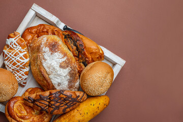 Homemade freshly baked bread. Wood rustic table, board. Bakery and baked goods bars, baguette,...