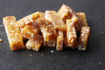 pea nuts sweet bar black background close up 