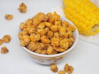 Homemde Jagung marning (Indonesia) or Corn nuts, also known as toasted corn, quico, or Cracker are a snack food made of roasted or deep-fried corn kernels.
