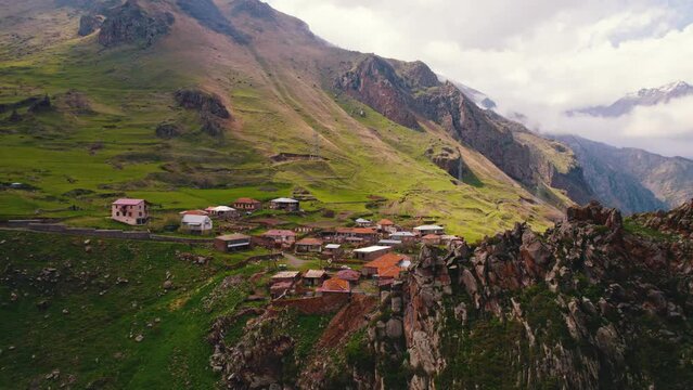 Mountain little village - hamlet - in the middle of mountain summits. Mountain community. High quality 4k footage