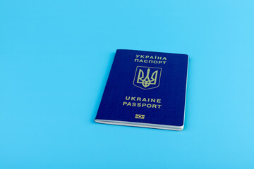 Ukrainian passport with a golden trident symbol on blue background. Biometric Ukraine passport id...