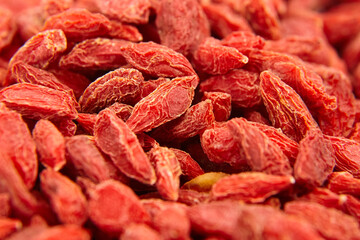 Dried goji berries red background