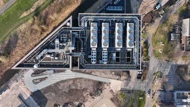 Data center telecommunication structure building aerial drone view. Digital computing storage database information center building in Amsterdam at Science park. Fly over.