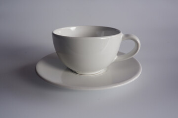 The cropped shot view of a cup of coffee on white background