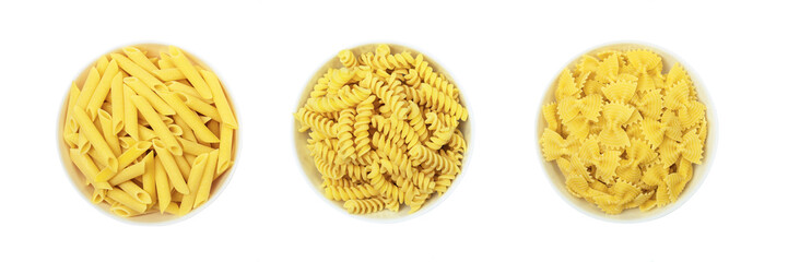 Set of pasta types in bowls isolated on white background, top view.