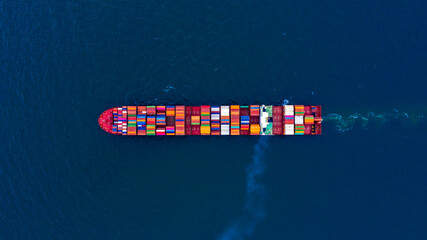Aerial view container ship at terminal commercial seaport freight shipping maritime vessel, Global...