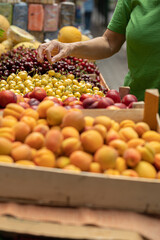 Close up womans hands holding fresh organic fruit