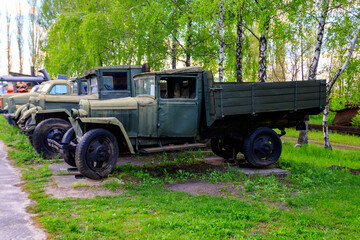 Rusty soviet retro trucks in Open air Museum of Folk Architecture and Folkways of Middle Naddnipryanschina in Pereyaslav, Ukraine