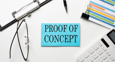 Stickers with chart,calculator and paper with text PROOF OF CONCEPT on the white background