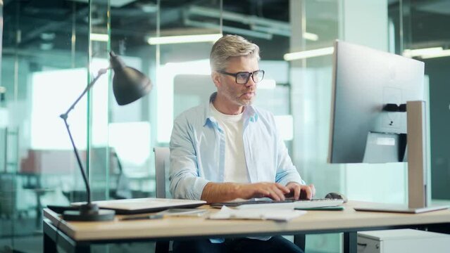 Mature Employee job done Satisfied office worker leaning back businessman relaxing after hard working day finished project on computer stretching at workplace happy ceo eyes closed taking pause