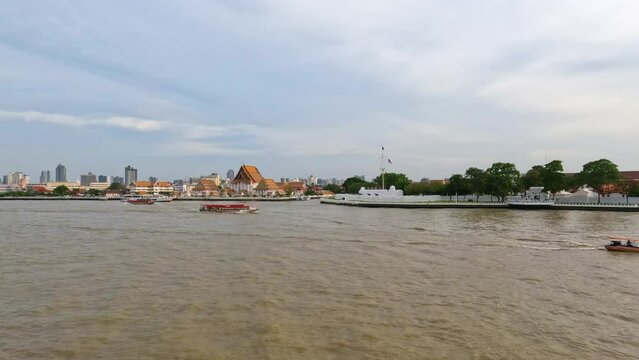 Bangkok city skyline with Wat Kalayanamit Woramahawihan Temple by the Chao Phraya River waterfront - realtime