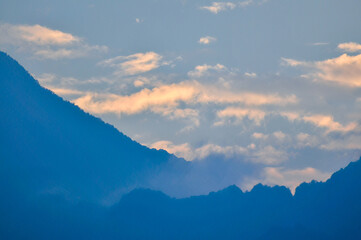 clouds over the mountains in sunset