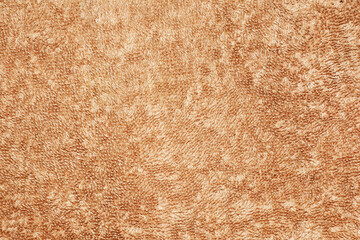 Texture of light brown cream towel for background, cloth or textile consists of a soft, dry, soft and clean cotton fiber material, abstract brown background.